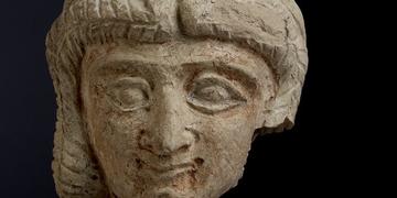 Head of woman in terracotta Detail of a terracotta head of a woman